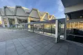 Photo: Space for posters and placards at the transition between the canteen building (Mensa) and the Audimax