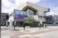 Photo: Giant outdoor banner at the Music Center at the transition from the university bridge to campus