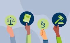 Diverse Hände mit Symbol-Schildern für rechtliche Angelegenheiten.