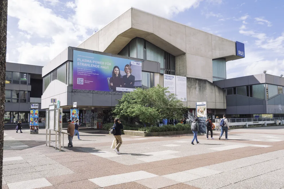 Photo: Giant outdoor banner at the Music Center at the transition from the university bridge to campus