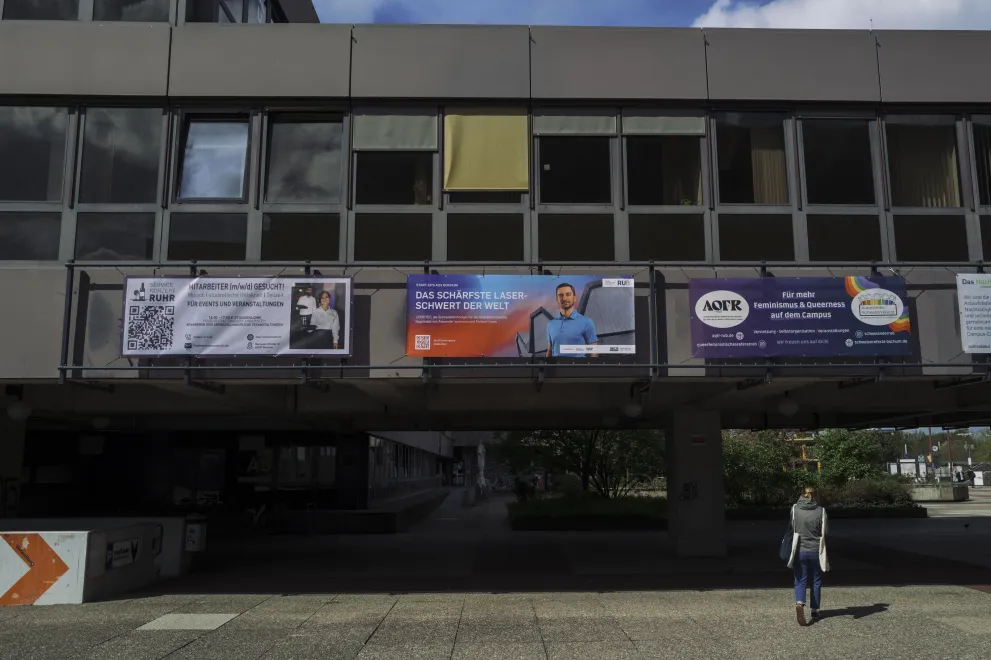 Photo: Posters on the crossbar between the Student House and the University Administration building